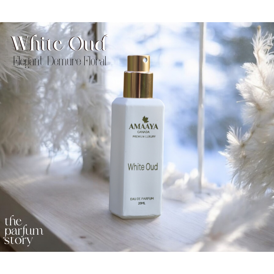 White Oud by Amaya Canada – luxury floral Eau de Parfum photographed by window light with white feathers